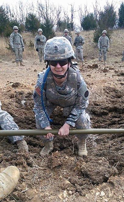First Sgt. Heather Javersak works in the field with other members of her engineer company.