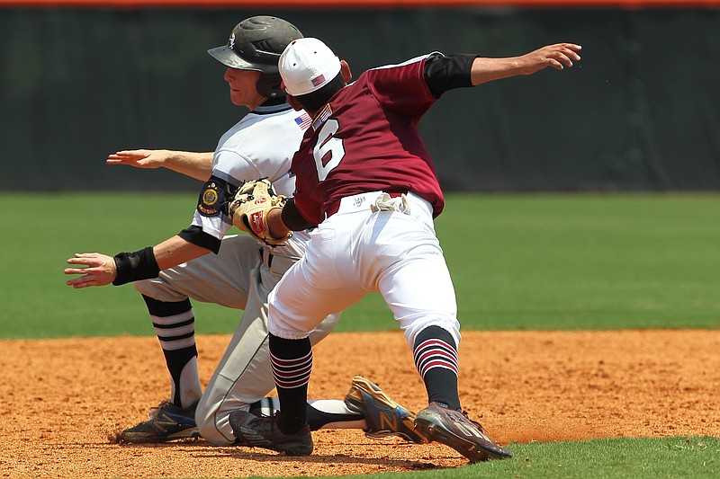 Texarkana Razorbacks second baseman Nick Myers attempts to make the tag on Bryant Black Sox runner Drew Tipton in the bottom of the fifth inning Saturday in Conway, Ark. 