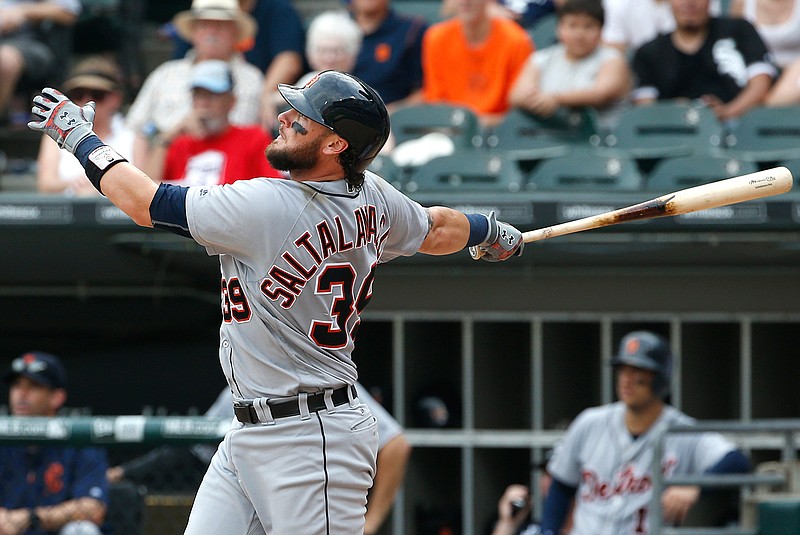 Detroit Tigers' Jarrod Saltalamacchia watches his solo home run during the ninth inning of a baseball game against the Chicago White Sox, Sunday, July 24, 2016, in Chicago.