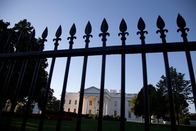 In this Sept. 22, 2014, file photo, the White House is photographed from Pennsylvania Avenue in Washington. Hillary Clinton should be in jail. Donald Trump threatens America's very existence. These are not fringe opinions. They are widespread views across the nation's bitter political divide. That means that on Nov. 9, the morning after Election Day tens of millions of Americans will awaken to the realization that someone they loathe will be the 45th president of the United States. 