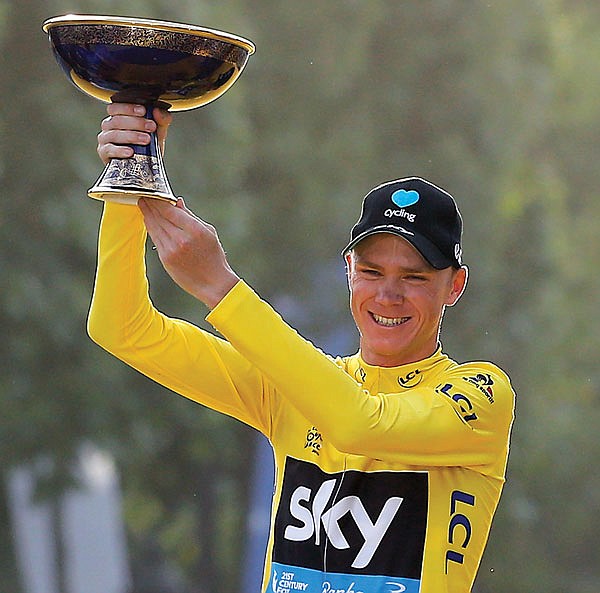 Tour de France winner Chris Froome celebrates on the podium Sunday in Paris.