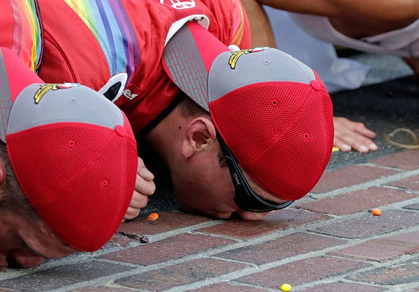 Kyle Busch kisses the yard of bricks at the start/finish line Sunday after winning the Brickyard 400 at Indianapolis Motor Speedway in Indianapolis.