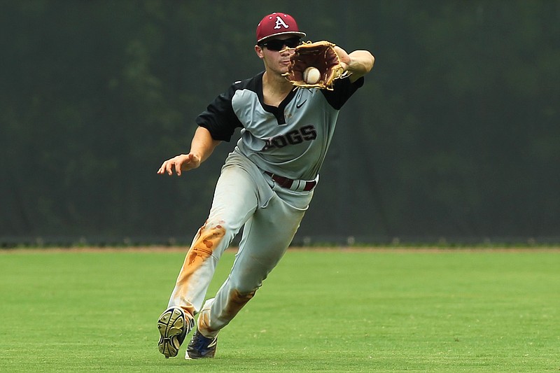 Texarkana Razorbacks'  Black Hall makes a catch in the bottom of the seventh inning against the Bryant Black Sox on Sunday, July 24, 2016 in Conway, Ark.