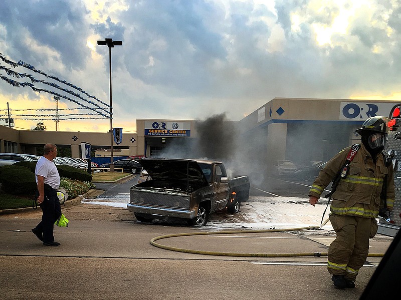 A truck burns Sunday afternoon, July 24, 2016 outside the Orr Volkswagen dealership in the 4500 block on North State Line Avenue.