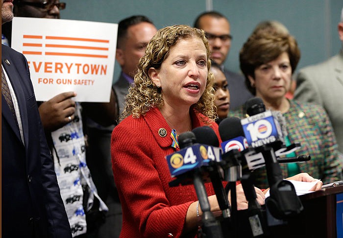 FILE - In a Tuesday, July 5, 2016 file photo, Congresswoman Debbie Wasserman Schultz, D-Fla., speaks during a news conference, in Fort Lauderdale, Fla. On Sunday, July 24, 2016, Wasserman Schultz announced she would step down as DNC chairwoman at the end of the party's convention. Her resignation follows the leak of some 19,000 emails, presumably stolen by hackers and posted to the website Wikileaks, that suggest the DNC favored Hillary Clinton over Bernie Sanders.  (AP Photo/Lynne Sladky, File)