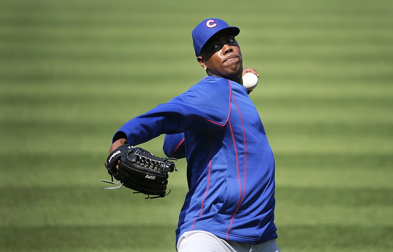 Chicago Cubs reliever Aroldis Chapman works out before a baseball game between the Cubs and Chicago White Sox Tuesday, July 26, 2016, in Chicago. 