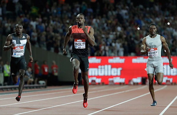 Usain Bolt (center) runs to a win in the men's 200-meter race July 22 during the Diamond League anniversary games at The Stadium, in the Queen Elizabeth Olympic Park in London.