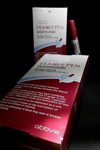 This Friday, July 18, 2014, file photo, shows AbbVie's signature drug Humira, in Houston.