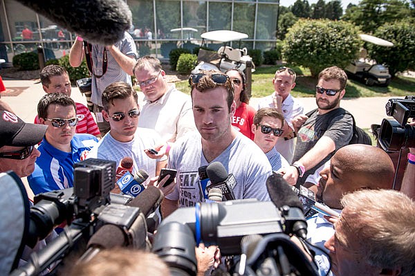 Chiefs quarterback Kevin Hogan (center) was surrounded by media while giving an interview as quarterbacks and rookies reported to training camp Tuesday at Missouri Western State University in St. Joseph.