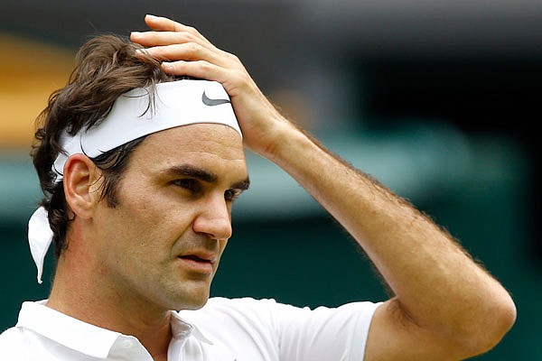 In this July 4 file photo, Roger Federer looks on during his men's singles match against Steve Johnson at Wimbledon in London. Federer said he will miss the Rio Olympics and the rest of the 2016 tennis season to protect his surgically repaired left knee.