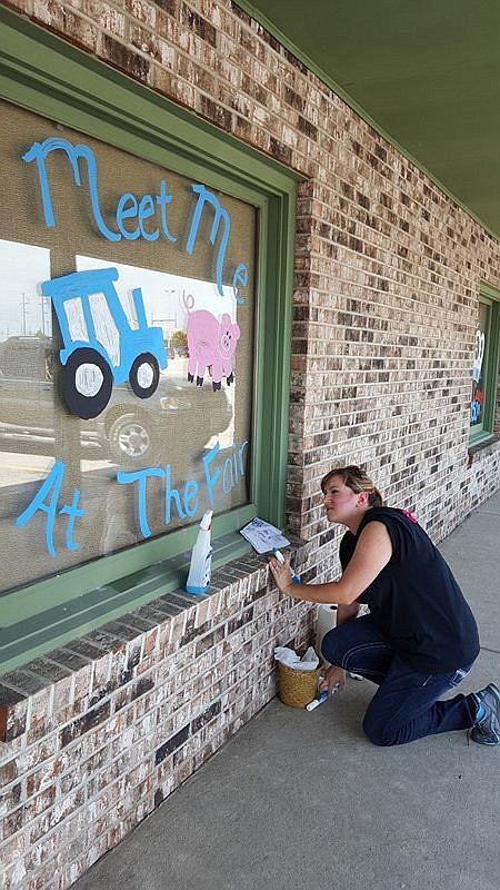 Submitted photo

Kim Lucas painted the windows at The Flower Shop recently after the fair committee asked local businesses and residents to decorate to help promote the 150th Moniteau County Fair that starts Monday.