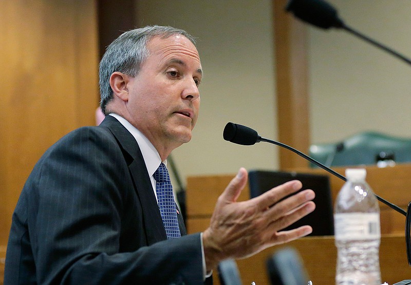 In this July 29, 2015, file photo, Texas Attorney General Ken Paxton speaks during a hearing in Austin, Texas. Paxton, who is under indictment on felony charges of duping investors in a tech startup, accepted $100,000 for his criminal defense from the head of a radiology provider while his office investigated the company for Medicaid fraud. 