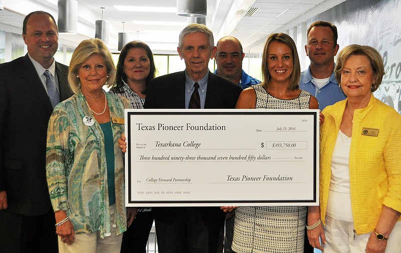 The Texas Pioneer Foundation recently gave Texarkana College $393,750 to fund a three-year college mentoring partnership for under-served students. College Forward, an Austin-based access and success program, will provide mentors to help guide low-income students to collegiate success.
From left to right:  TC President James Henry Russell, TC Trustee Jane Daines, TC Trustee Kaye Ellison, Texas Pioneer Foundation Executive Director Fred Markham, TC Trustee Ernie Cochran, TC Foundation Director Katie Andrus, TC Trustee Ken Reese and TC Trustee Anne Farris.
