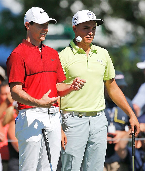 Rory McIlroy (left) talks with Rickie Fowler as they wait on the fifth hole during a practice round Tuesday for the PGA Championship at Baltusrol Golf Club in Springfield, N.J.