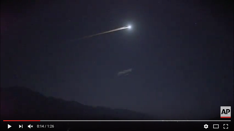 This screen capture taken from AP video shows debris from a Chinese rocket re-entering the atmosphere Wednesday night, July 27, 2016.