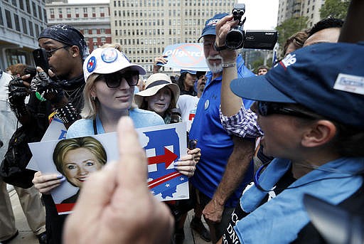 Demonstrators square off during a rally outside City Hall in Philadelphia, Wednesday, July 27, 2016, during the third day of the Democratic National Convention.