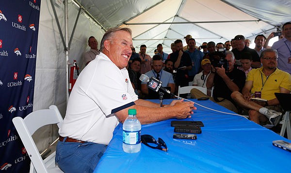 Broncos general manager John Elway speaks during a news conference before the team's opening of training camp Wednesday in Englewood, Colo.