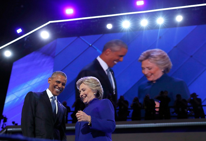 President Barack Obama is joined by Democratic Presidential candidate Hillary Clinton after speaking to the delegates during the third day session of the Democratic National Convention in Philadelphia, Wednesday, July 27, 2016. 