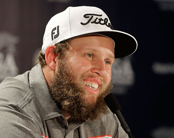 Andrew Johnston, of England, smiles as he answers a question before Wednesday's practice round for the PGA Championship at Baltusrol Golf Club in Springfield, N.J.