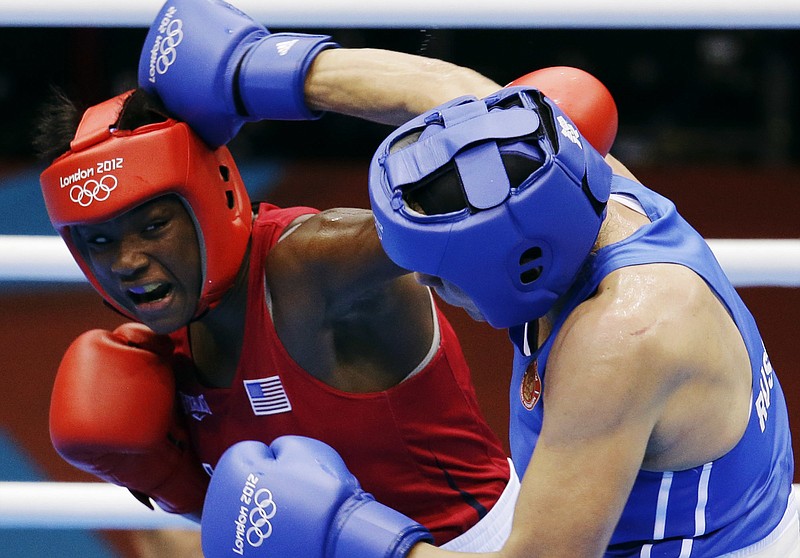 In this Aug. 9, 2012, file phto, Claressa Shields, of the United States, in red, fights Russia's Nadezda Torlopova, in blue, in a women's middleweight 75-kg boxing gold medal match at the 2012 Summer Olympics. The next wave of women's boxing has arrived in Rio de Janeiro to build on the momentum of the inaugural Olympic tournament in London. 