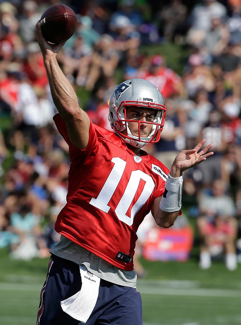 New England Patriots quarterback Jimmy Garoppolo throws a pass during an NFL football training camp practice Thursday, July 28, 2016, in Foxborough, Mass.