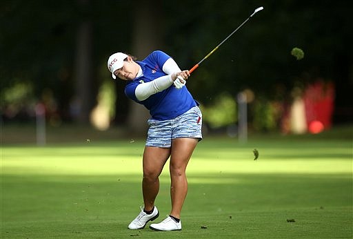 Thailand's Ariya Jutanugarn in action during day three of the Women's British Open at Woburn Golf Club in Woburn, England, Saturday, July 30, 2016. The Women's British Open was established by the Ladies' Golf Union in 1976 and was intended to serve as the women's equivalent of The Open Championship. (Steve Paston/PA via AP)