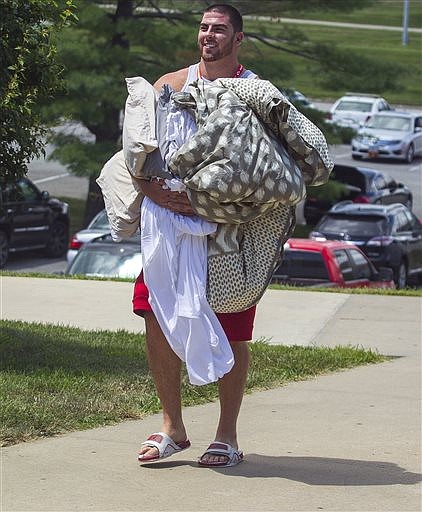 Kansas City Chiefs offensive lineman Eric Fisher walks to Scanlon Hall at Missouri Western State University during move in for NFL football training camp, Friday July 29, 2016 in St. Joseph, Mo. (Dougal Brownlie/The St. Joseph News-Press via AP)