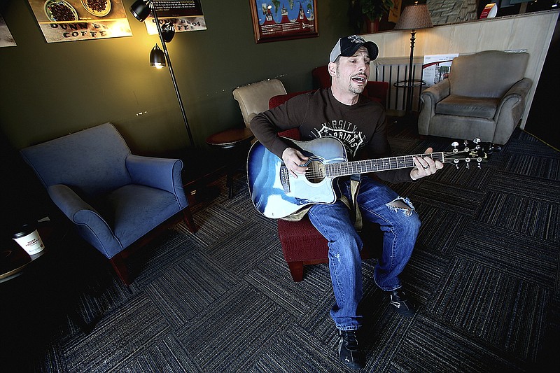 Billy Jack Purnell plays his music earlier this year in the Dunn Bros Coffee on Edgewood Drive. The local muscian is competing in a Nashville radio contest sponsored by Cumulus media group.