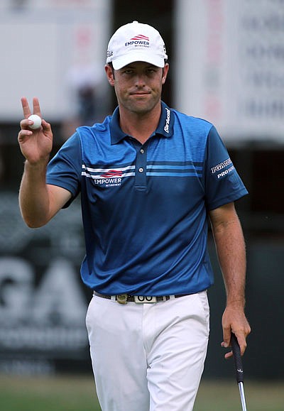 Robert Streb waves to the crowd after making a putt on the ninth hole during Friday's second round of the PGA Championship at Baltusrol Golf Club in Springfield, N.J.