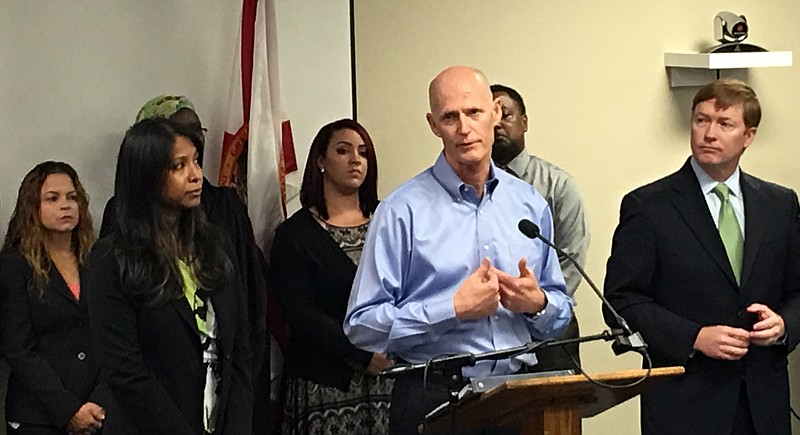 Florida Gov. Rick Scott speaks at a news conference, Friday, July 29, 2016, in Orlando, Fla., where he announced that the state likely has the first cases of Zika transmitted by mosquitoes on the U.S. mainland. 