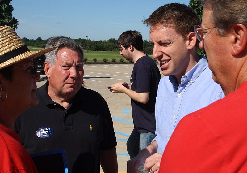 Missouri Secretary of State Jason Kander (in blue) talks to a group of people at Callaway Electric Cooperative in Fulton on Saturday. He is running for United States senator in the Aug. 2 primary on the Democratic ballot.