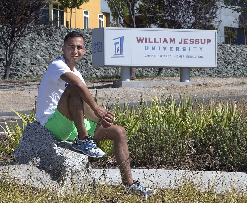 In this photo taken Thursday, July 21, 2016, Anthony Villarreal poses outside of William Jessup University in Rocklin, Calif. Villarreal, had been a member of the school's cross country and track teams before he was expelled in 2013, which, he says, was because the university found out he is gay. Sen. Ricardo Lara, D-Bell Gardens introduced SB1146 which would expand state LGBT protections by removing the state's exemption for religious colleges and universities for anti-discrimination policies. 