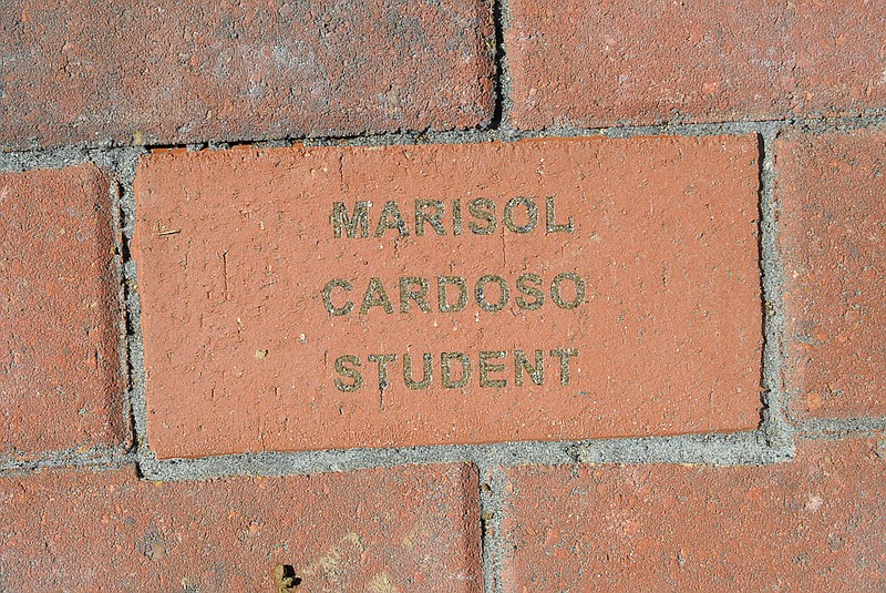 This is one of 14 memorial bricks dedicated Saturday at the new memorial in front of California High School to remember students or employees who died while studying or working in the school district.