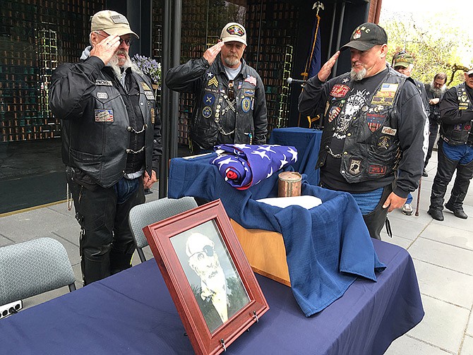 Patriot Guard Riders, from left to right, Steve West, Milt Harden and Dan Halverson salute the cremated remains of Maine Civil War soldier Jewett Williams on Monday in Salem, Oregon, before the ashes are handed over for a motorcycle journey across the country to Williams' home state where he will be buried with military honors.