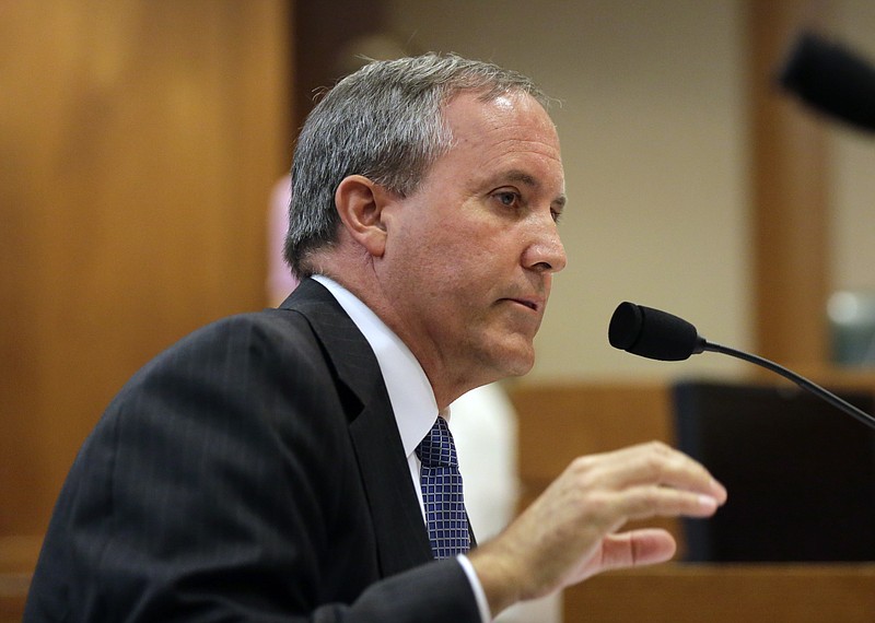 In this July 29, 2015, file photo, Texas Attorney General Ken Paxton speaks during a hearing in Austin, Texas. Paxton, who is under indictment on felony charges of duping investors in a tech startup, accepted $100,000 for his criminal defense from the head of a radiology provider while his office investigated the company for Medicaid fraud. 