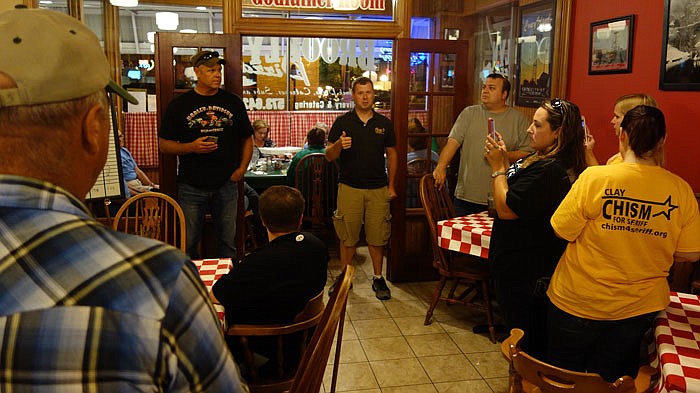 Clay Chism speaks to a crowd of supporters Tuesday night at Brooklyn's Pizza. Chism won the Republican primary for Callaway County sheriff.