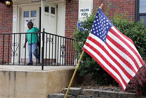 Voter Alice Davis leaves the polls after casting her ballot in Florissant, Mo., during Missouri's state primary election Tuesday, Aug. 2, 2016. (Laurie Skrivan/St. Louis Post-Dispatch via AP)