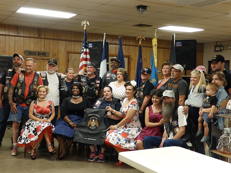 Members of the New Boston, Texas, chapter of Legion Riders and Pinups for Vets pose for pictures. This one tight-knit group of people who were all proud to be a part of the charitable event for the veterans—after all, most of them are veterans themselves.
