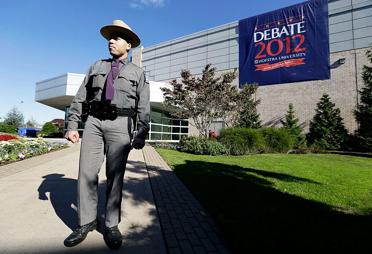 New York state trooper Gary DePass stands outside Hofstra University's David S. Mack Sports Complex in Hempstead, New York, before a 2012 presidential debate. 