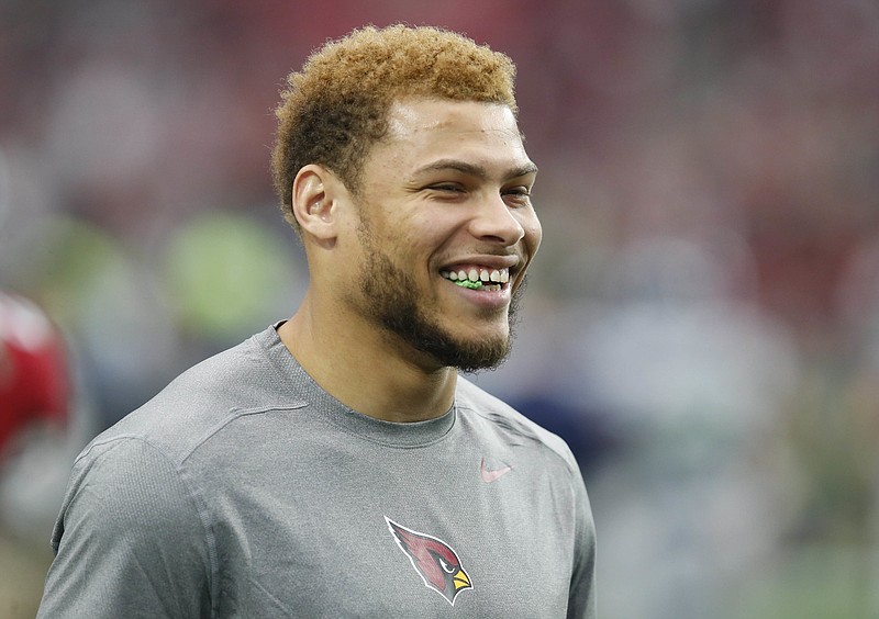 In this Jan. 3, 2016, file photo, Arizona Cardinals free safety Tyrann Mathieu watches warm ups prior to an NFL football game against the Seattle Seahawks, in Glendale, Ariz. A person with knowledge of the situation tells The Associated Press that the Arizona Cardinals and All-Pro defensive back Tyrann Mathieu have agreed to a five-year, $62.5 million contract extension, with $40 million guaranteed. The person spoke to the AP on condition of anonymity Tuesday, Aug. 2, 2016,  because the agreement had not been officially announced.