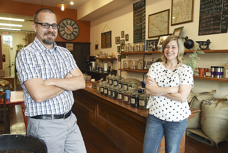 Tony and Sarah Anderson pose in their Dunklin Street location of Three Story Coffee.