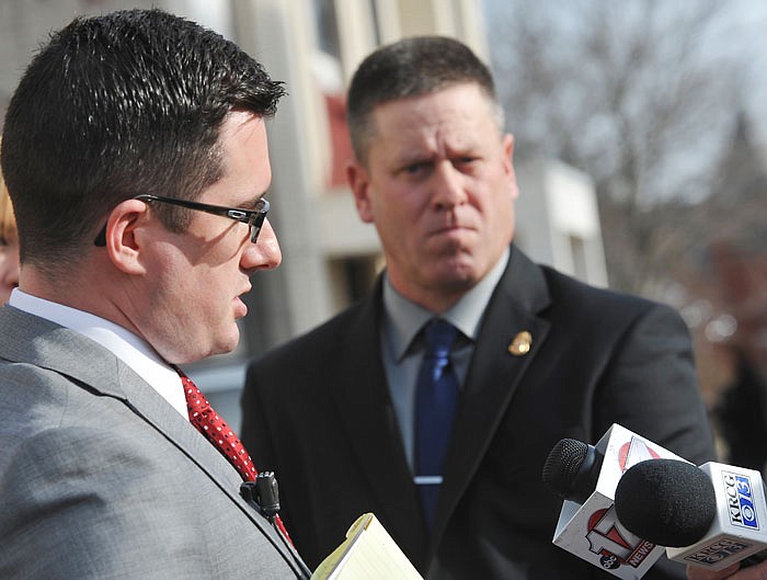 Osage County Sheriff Michael Dixon is interviewed in early 2015 outside the Cole County Courthouse after a hearing. In the background is Chief Deputy Ron Dishman, who served briefly as sheriff after Dixon resigned.