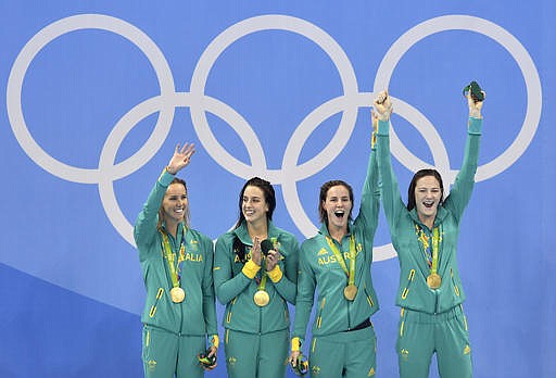 From left Australia's Emma McKeon, Brittany Elmslie, Bronte Campbell and Cate Campbell celebrate after winning the gold medal in the women's 4x100-meter freestyle final during the swimming competitions at the 2016 Summer Olympics, Saturday, Aug. 6, 2016, in Rio de Janeiro, Brazil.