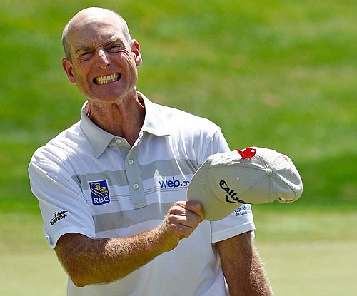 Jim Furyk celebrates after shooting a PGA Tour-record 58 during Sunday's final round of the Travelers Championship in Cromwell, Conn.