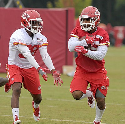Chiefs running back Charcandrick West tries to avoid defensive back Shannon Edwards during practice last week in St. Joseph.