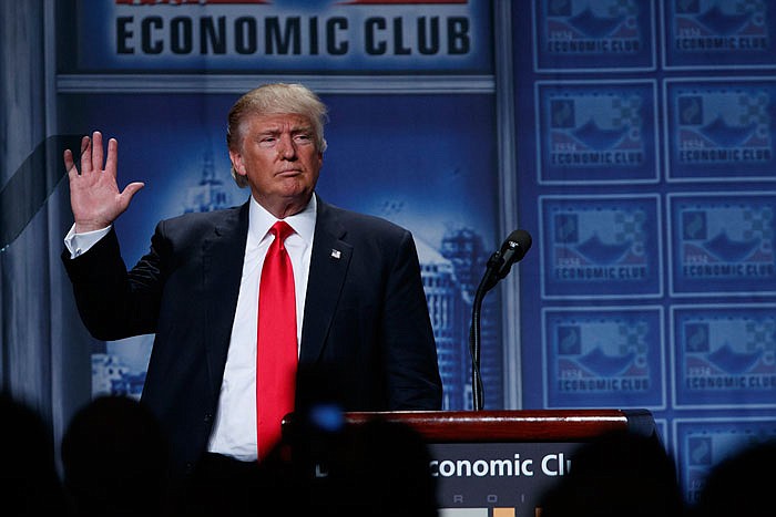 Republican presidential candidate Donald Trump waves after delivering an economic policy speech to the Detroit Economic Club on Monday.