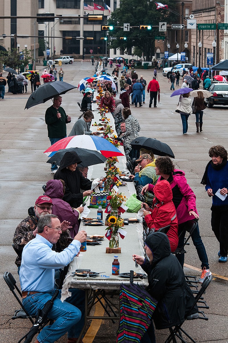 Citizens didn't let the rain stop them from coming together to attend the first Dine on the Line event Friday night, Oct. 30, 2015, in downtown Texarkana.