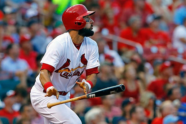 Cardinals infielder Matt Carpenter watches his triple during the third inning of Wednesday night's game against the Reds in St. Louis.