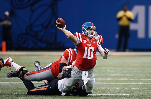 In this Jan. 1 file photo, Mississippi quarterback Chad Kelly is tackled as he passes in the second half of the Sugar Bowl against Oklahoma State in New Orleans.