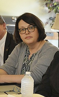 In this May 27, 2015 file photo, Kelly Smith is seen representing River City Habitat for Humanity at a meeting in Jefferson City of local, state and federal housing officials.